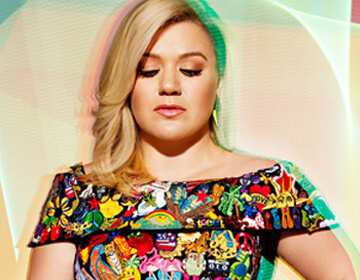 close-up of Kelly Clarkson wearing colourful dress