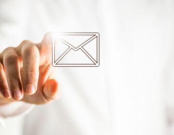 hand pointing at email icon